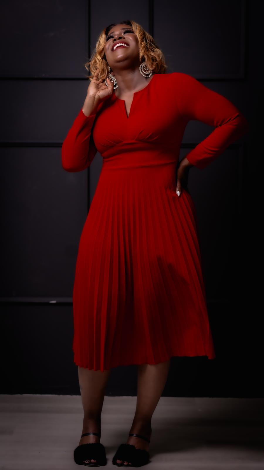 Nicole Wilson wearing a red dress