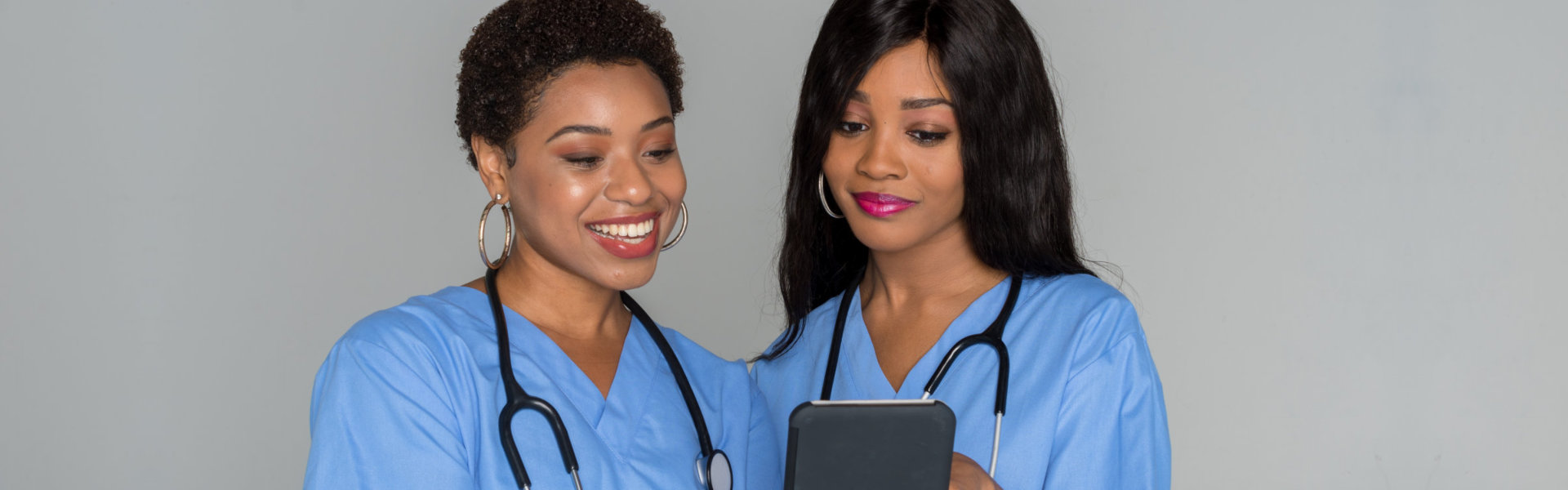 two nurse smiling